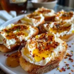 Sweet and Spicy Whipped Feta Crostini with Hot Honey