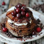 Black Forest Pancakes with chocolate chips and fresh cherries